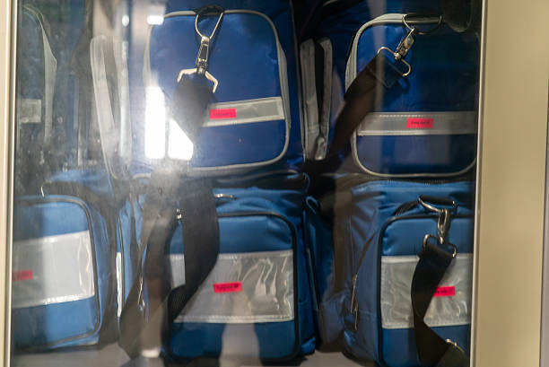 A collection of blue insulated lunch bags neatly stored, showcasing their practical design and sturdy construction, ideal for meal preparation and transport.