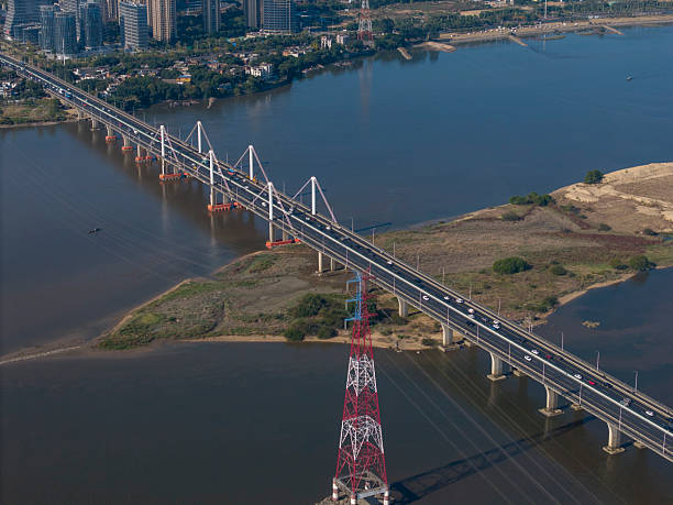 istock Aerial View of a Long Bridge Spanning a River 2252867967