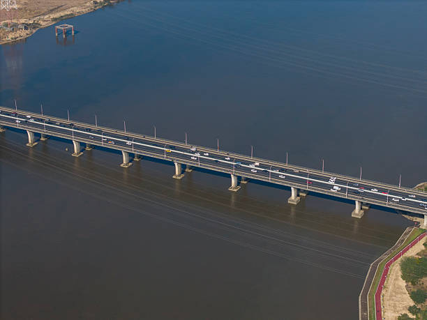 istock Aerial View of a Long Bridge Spanning a River 2252867968