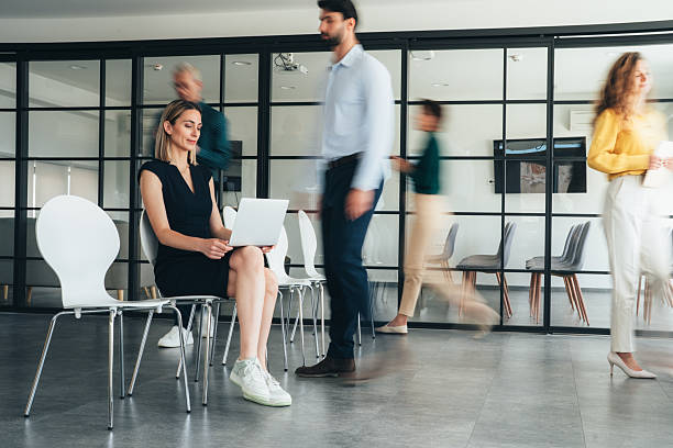 istock Focus in Motion - Busy modern workplace 2252868793