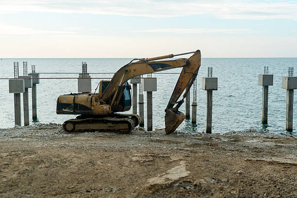 istock Excavator Working by the Water's Edge 2252870730