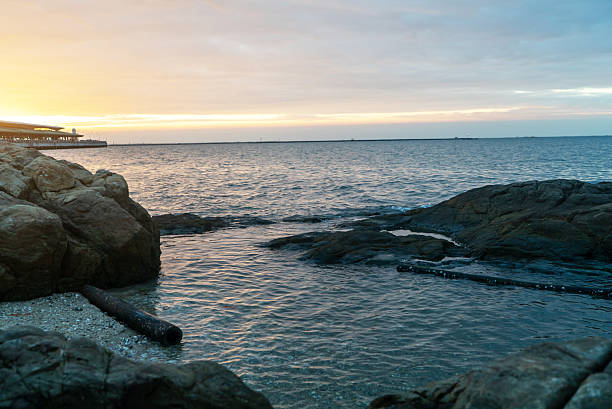 istock Serene Coastal View at Sunset With Rocks 2252870879