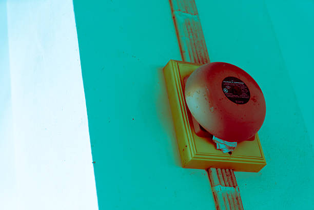 Red alarm bell isolated on white. Clipping path is included.