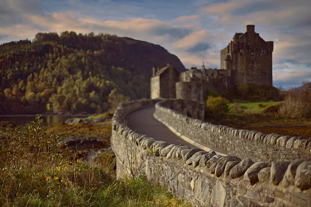 Dornie, Scotland-October 23, 2022: Eilean Donan island and its medieval castle, originated in the XIII century and reconstructed and connected to the mainland by a footbridge in the early XX century.