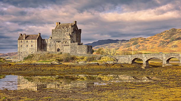 Dornie, Scotland-October 23, 2022: Eilean Donan island and its medieval castle, originated in the XIII century and reconstructed and connected to the mainland by a footbridge in the early XX century.