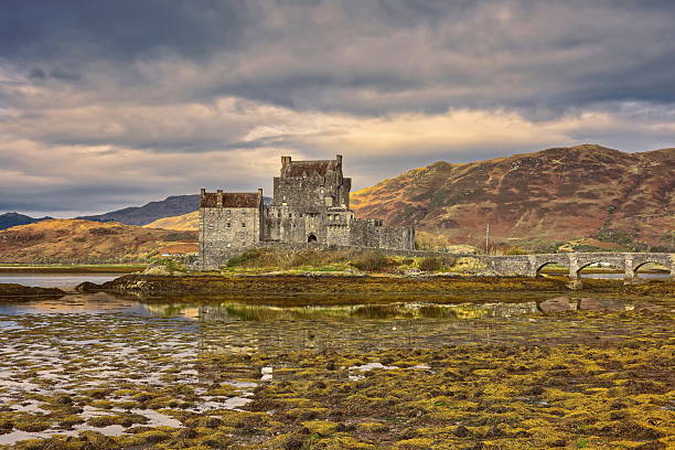 Dornie, Scotland-October 23, 2022: Eilean Donan island and its medieval castle, originated in the XIII century and reconstructed and connected to the mainland by a footbridge in the early XX century.