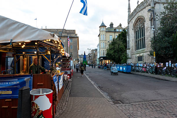 Cambridge, UK - November 28, 2025: Cambridge market opposite a church with a Christmas tree in the background