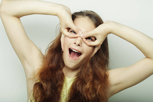 Beautiful young surprised woman. Studio shot.