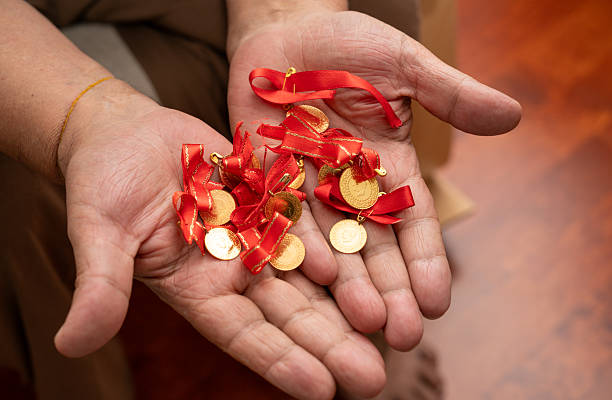 istock Man with gold coins in the hand 2252885454
