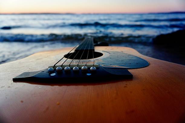 istock Beach waves and a Guitar at Sunset 2252889470