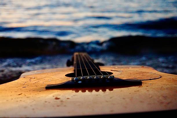 istock Beach waves and a Guitar at Sunset 2252889489