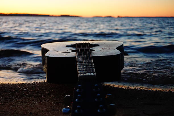 istock Beach waves and a Guitar at Sunset 2252889496