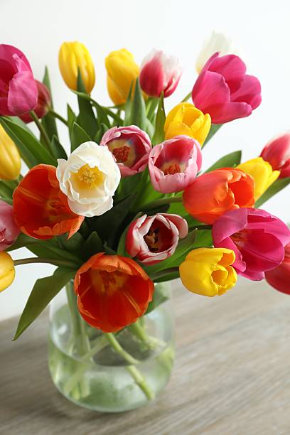istock Beautiful fresh tulips in a vase on the table 2252892153