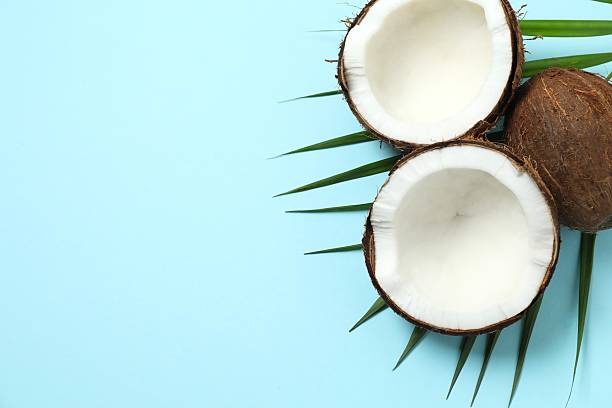 istock Coconut on blue background, top view 2252892225