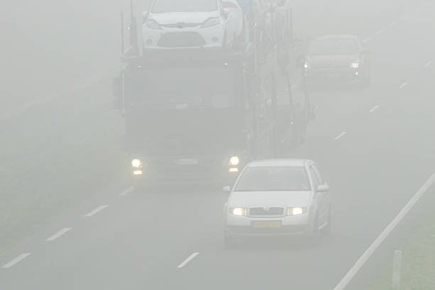 istock Cars driving through dense fog on highway 2252893348