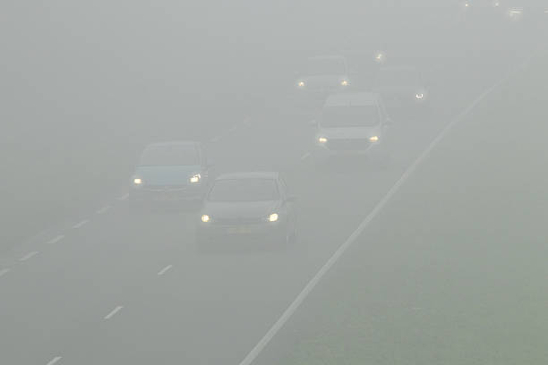 istock Cars driving through dense fog on highway 2252893349