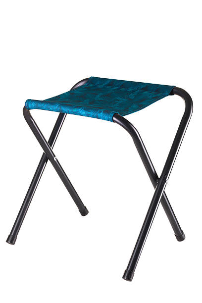 istock Lightweight and portable folding stool ideal for outdoor use, camping, and picnics. It features a sturdy frame and a comfortable seat, perfect for relaxing anywhere 2252893671