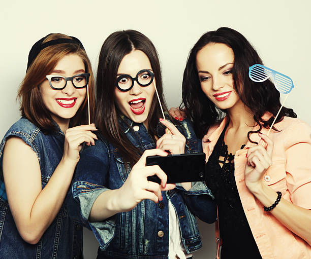 istock funny girls, ready for party 2252897303