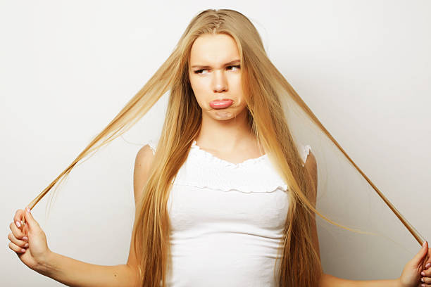 Beautiful young surprised woman. Long blond hair and cute face.