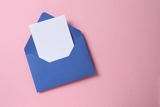 istock Blue envelope with white paper card on color background 2252899423