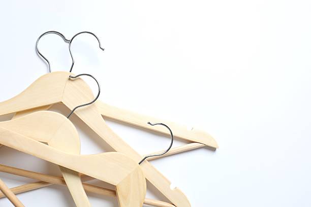 istock Wooden clothes hangers on a white background 2252901182