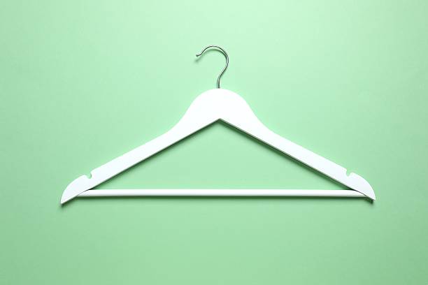 istock Wooden clothes hanger on a colored background 2252901185