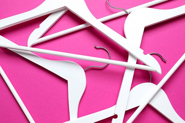 istock Wooden clothes hangers on a colored background 2252901203