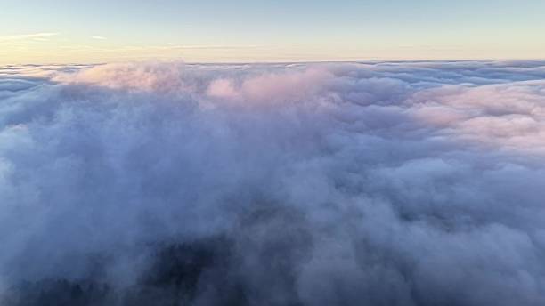 istock Misty Sunrise Imagery, Thick Cloud Layers Unfold With Warm Light And Rich Textures Suitable For Film Openings 2252903301