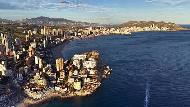 istock Vivid High Altitude Image Showcasing Opulent Yacht Alongside Glowing Beachfront Skyscrapers 2252906410