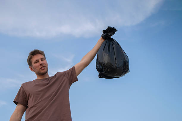 Senior environmentalist city worker cleaning up Amsterdam