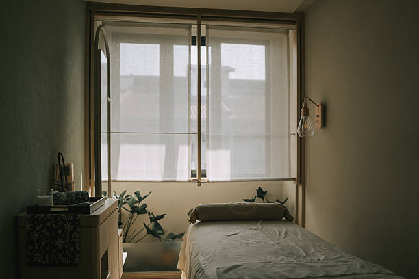 istock Minimalist massage therapy room interior with empty treatment bed and copy space 2252910955
