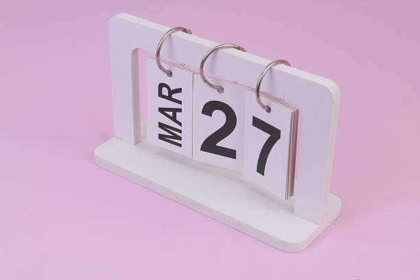 istock March 27 on calendar on pink background 2252910957