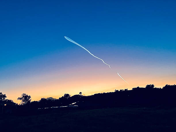 istock Jet Flying Across a Vibrant Sunset Sky 2252911006