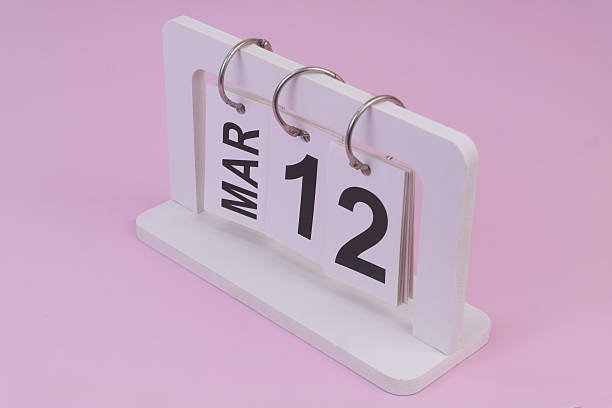 istock March 12 on calendar on pink background 2252911924