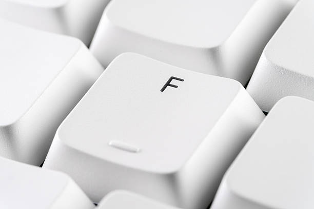 Macro shot of a white keyboard F key with copy space