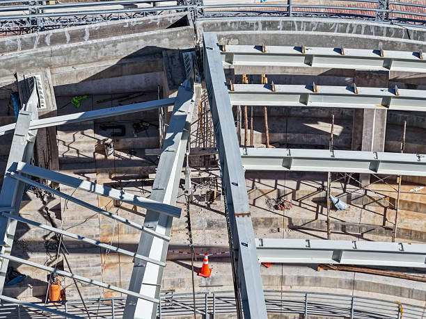 istock Aerial view of a coliseum with a collapsed metal structure and undergoing structural inspections 2252914059