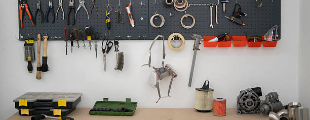 istock A well-organized workspace in a car service setting showcases various tools and equipment mounted on a pegboard, ideal for vehicle maintenance and repairs. 2252914766
