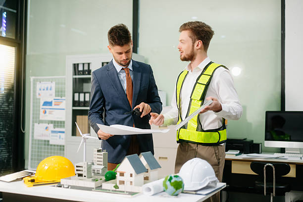 istock Engineer teams meeting working together wear worker helmets hardhat with on architectural project site 2252916390