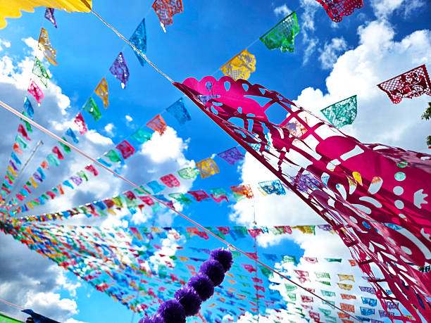 Wind-blown papel picado decoration during Day of the Dead