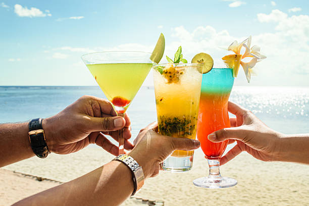 istock Tropical Cocktails Toast on Beach 2252919640