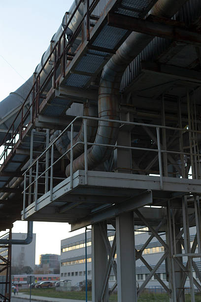 istock Sculptural industrial pipes with reflective surfaces and structural details 2252920403