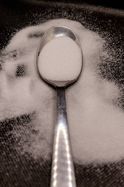 Fine salt, coarse salt, fine flour, cumin spice in a spoon.