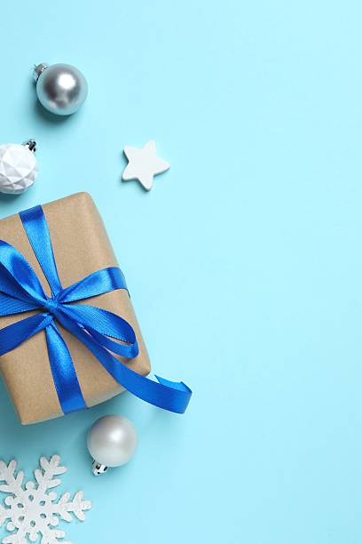 istock Christmas gift box and decorations on blue background,  seasonal greeting 2252926316