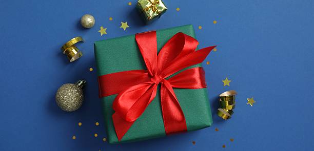 istock Festive Christmas composition with gift box and decorations, top view 2252926432