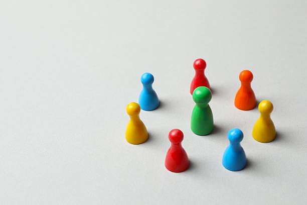 istock Group of pawns on the table. Concept of unity 2252928493