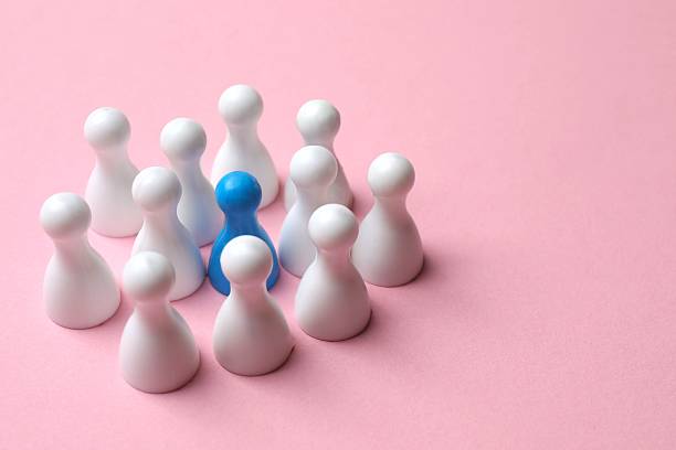 istock Group of pawns on the table. Concept of unity 2252928496