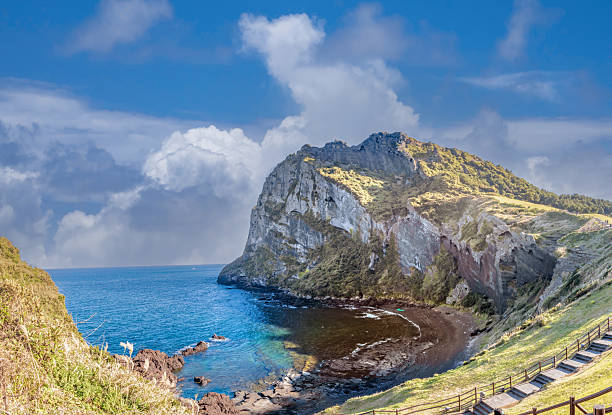 Seongsan Ilchulbong Tuff Cone (Sunrise Peak)a UNESCO World Heritage site is a dramatic volcanic cone that rose from a shallow seabed during an explosive hydrovolcanic eruption around 5,000 years ago. Jeju Island, South Korea
