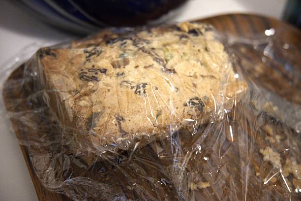 istock Fruit Bread Wrapped in Plastic on Wooden Tray 2252934290