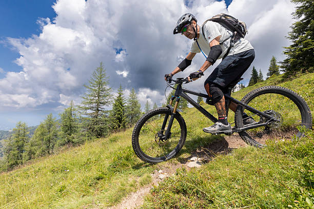 istock Mountain biker on narrow pasture turn. 2252934296