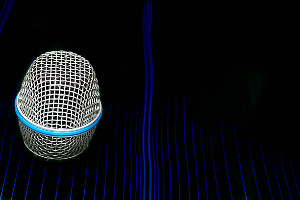 an instrument for converting sound waves into electrical energy variations which may then be amplified, transmitted, or recorded.